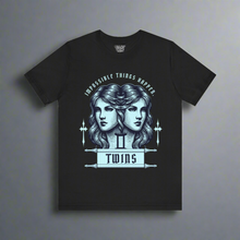 Load image into Gallery viewer, Illustration of two identical female faces side-by-side, surrounded by ornate designs and flanked by two vertical swords, with the phrases 'Impossible Things Happen' above and 'TWINS' below, in blue and white on a black t-shirt background.